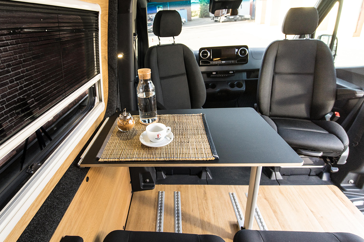 VanMe Camperausbau Mobile table with mounting on a C-rail and a folding leg Swivel consoles for the front two individual seats in the cockpit 